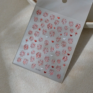 Detail of red and white 3D firework nail art decals with heart and star patterns