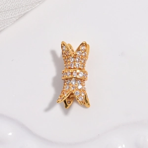 Macro view of gold-plated double-layer waist pendant with sparkling white zircons