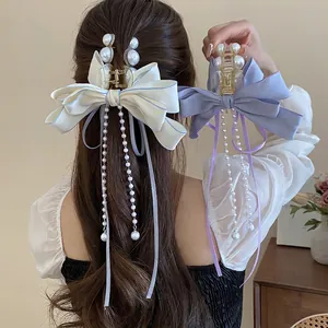 Elegant multi-layered bow hair claw clip with pearl tassels for women's hairstyle