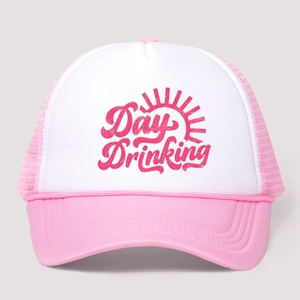 Pink and white mesh trucker hat featuring a Day Drinking print and sun rays icon