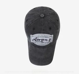 Detail of vintage washed black baseball cap with retro Aero New York embroidery patch