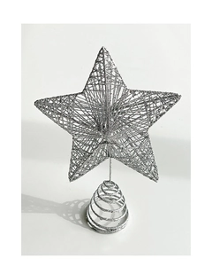 Close-up of silver hollow woven metal Christmas tree topper star with sequins decoration