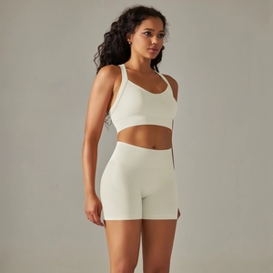 Detail of seamless cream white sports bra and high waist shorts yoga set for women