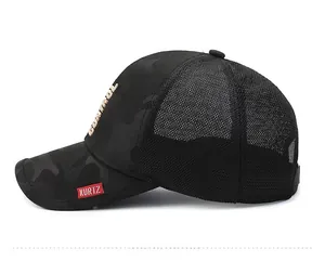 Detailed side view of mesh baseball cap with gold embroidery and a woven label