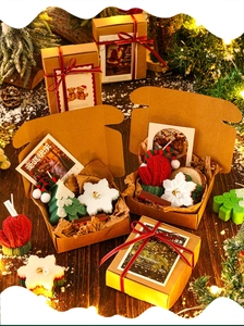 Macro view of Christmas scented candle gift set with mini tree, snowflake and ginger man