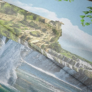 Detailed view of soft textured polyester fabric with high-definition cliff castle landscape print