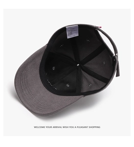 Detail view of cotton baseball cap interior with six-panel stitching and white care label