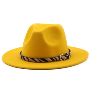 Close-up of bright yellow wool fedora hat featuring zebra print belt and metal buckle