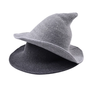 Knit witch-style pointed hat in dark and light grey with coarse texture for winter fashion