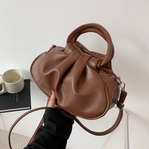 Brown pleated cloud shoulder bag in retro PU leather shown with hand-carry handle