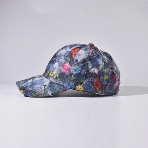 Unisex denim baseball cap with floral embroidery and butterfly graffiti on side view