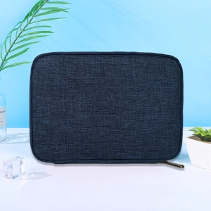 Close-up of a navy blue fabric watch strap organizer with a textured finish and zipper