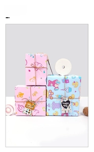 Detail of pink and blue baby shower gift wrap with bear motifs and decorative hang tags