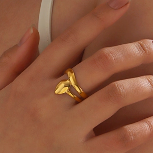 Polished 18K gold-plated stainless steel geometric leaf ring worn on a finger