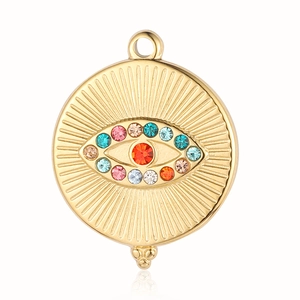 Macro detail of golden evil eye pendant with colorful rhinestones and radial patterns