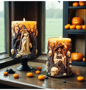 Detailed 3D witch and skull relief carvings on handmade Halloween scented candles