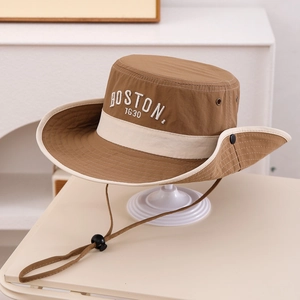 Detail of Boston 1630 embroidery on khaki bucket hat with windproof drawstring