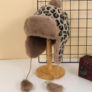 Winter leopard print trapper hat with warm faux fur lining and ear flaps for skiing