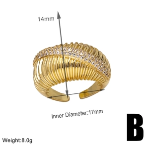 Detail view of gold horn-shaped ring with zircon inlay and product dimensions 14mm height