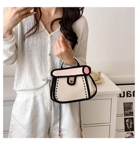Detail of 2D comic style canvas bag with black outlines and metallic chain strap