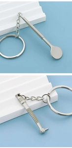 Detail van zilveren tandheelkundige sleutelhangers met mondspiegel en boorhangers