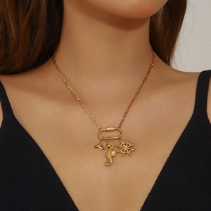 Gold seahorse and helm pendant necklace on paperclip chain for a creative nautical look