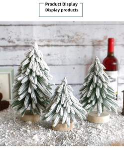 Three-piece frosted mini Christmas trees with round wooden bases for holiday decor