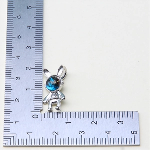 Size measurement showing a silver rabbit astronaut pendant with starry face design