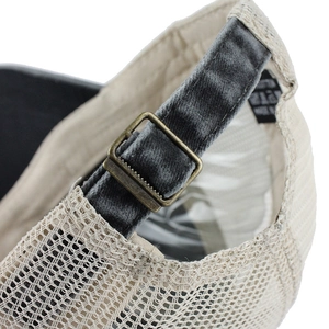 Detail of breathable mesh baseball cap with adjustable velvet strap and bronze buckle
