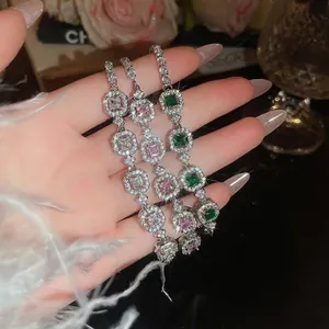 French palace style emerald and diamond geometric bracelets with halo setting in silver finish