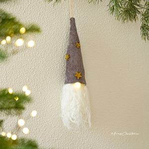 Hanging Christmas gnome with gray hat, gold star, white beard and warm LED lights