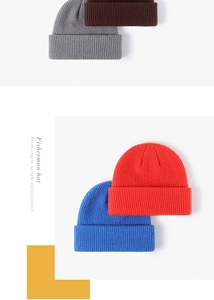 Detailed knit texture of four beanies in grey, coffee, red, and blue with thick ribbed fold