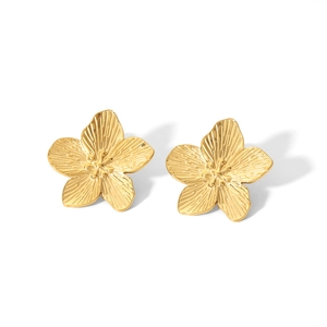 French vintage style gold flower earrings crafted in stainless steel on white background