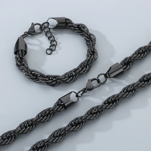Close-up of black 10mm stainless steel twist rope chain necklace and bracelet set