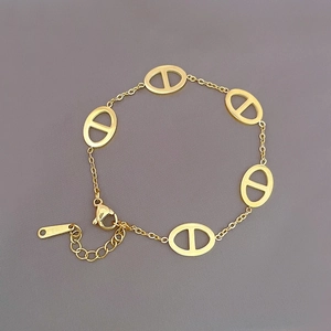 Minimalist gold titanium coffee bean link bracelet with lobster clasp and extension chain