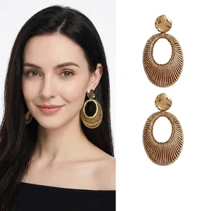 Golden velvet woven oval pendant earrings with hollow spiral design for women