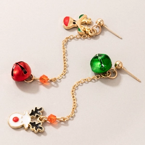 Detail of Christmas earrings featuring red green bells and enamel reindeer on gold chains