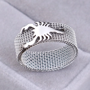 Detail of silver 8mm scorpion ring with woven mesh band in a gray jewelry box
