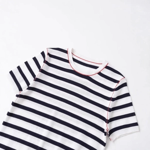 Short sleeve knit top with black and white stripes and contrast red stitching accents