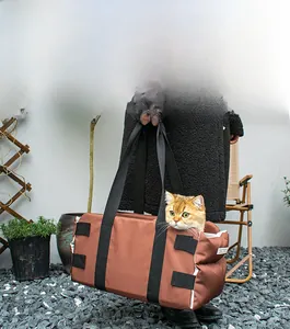 Brown dog car seat carrier with breathable side opening and wide shoulder strap