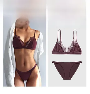 Detailed view of burgundy lace lingerie set featuring eyelash trim and silky fabric