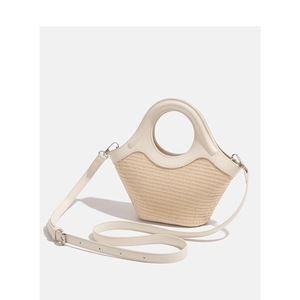 Fashionable straw woven handbag with cream PU leather handles and adjustable shoulder strap