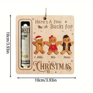 Macro detail of 10cm square wooden Christmas money holder with gingerbread man engraving