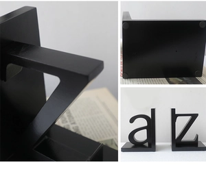 Detail of modern black A-Z bookends showing non-slip base pads and sleek metal texture