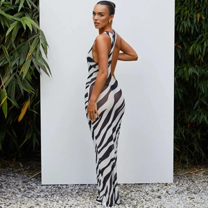 Detail view of backless zebra print mesh dress featuring a slim fit and sleeveless cut