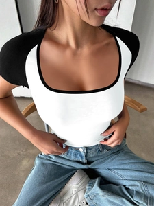 Close-up of contrast binding on U-neckline and raglan sleeves of a Y2K slim-fit T-shirt