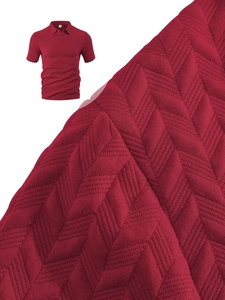Macro shot of red polo shirt featuring a textured herringbone knit pattern and soft fabric