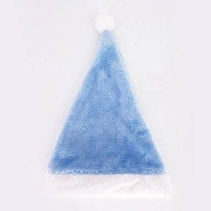 Detailed close-up showing soft blue plush texture and white faux fur trim of a Christmas hat