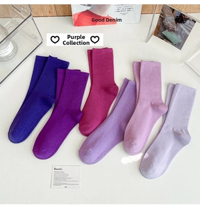 Detail view of purple ribbed mid-calf socks in six gradient shades from deep to lavender