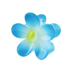 Macro shot of blue flower hair claw clip with gradient petals and glossy finish